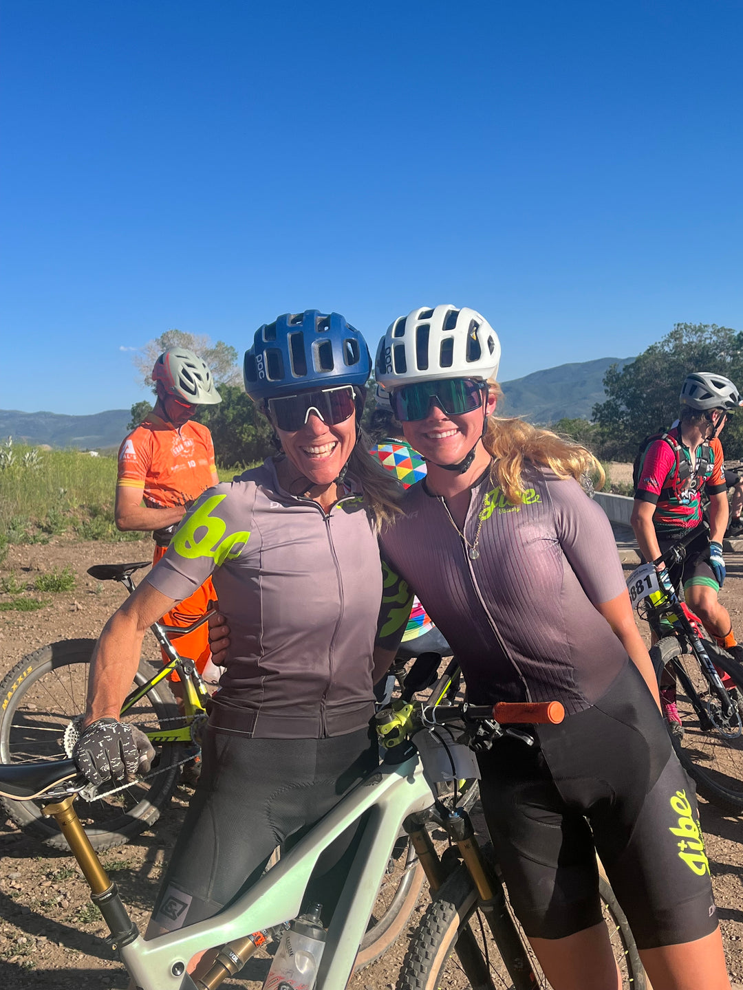Kaya and Renae smiling in their Jibe factory kits.
