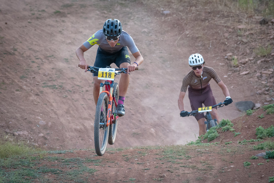 Jamerson Kent flying over a hill with Braden Mcnichols close behind.