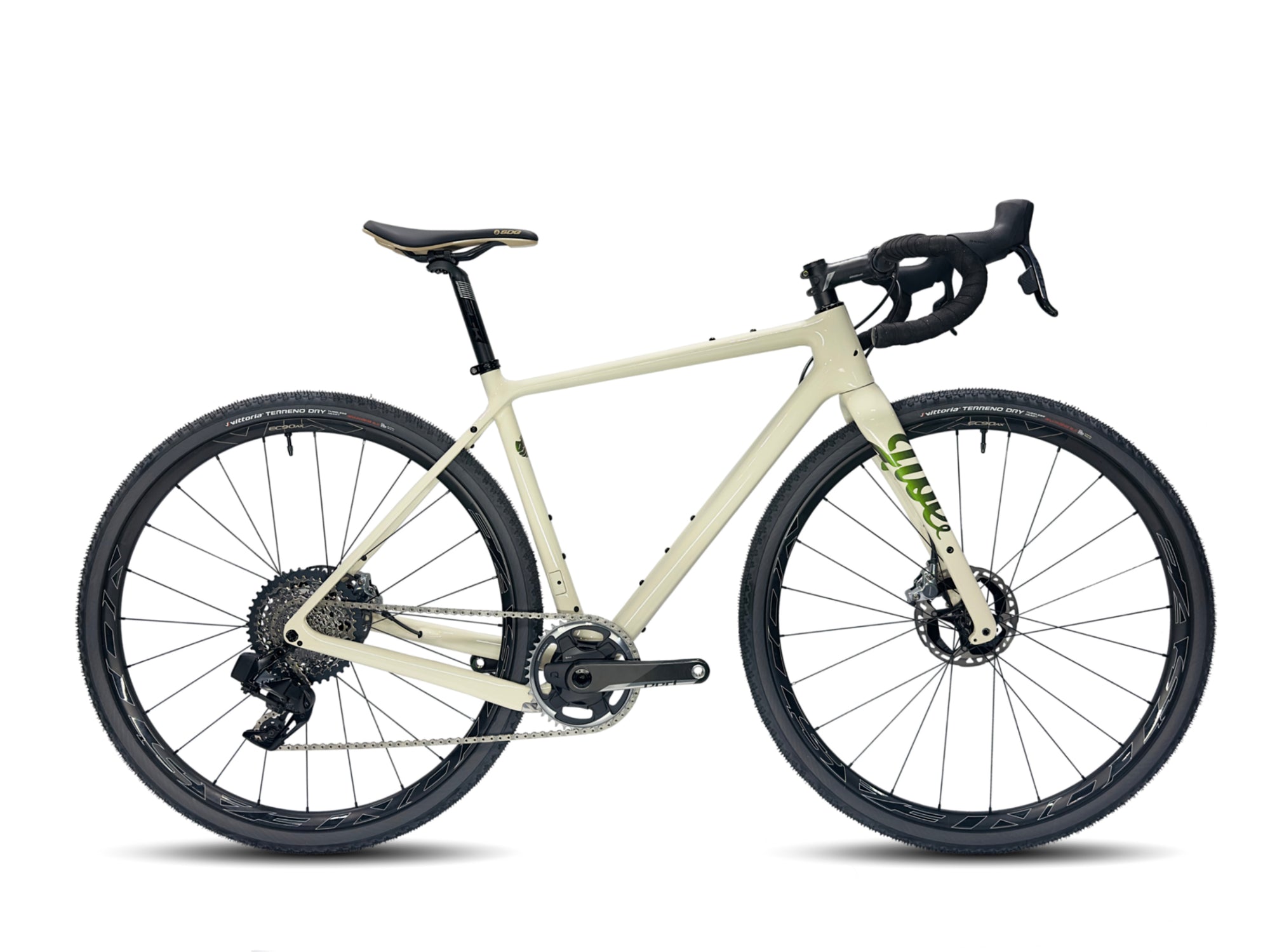 A Jibe gravel bike in a creamy white color with green decals. It is built with Sram Red XPLR AXS and carbon wheels.