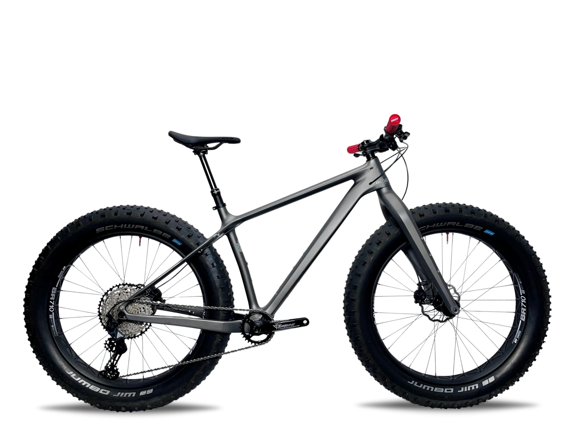 Jibe Chubber in the color Cannonball with a dropper post and fat tires.